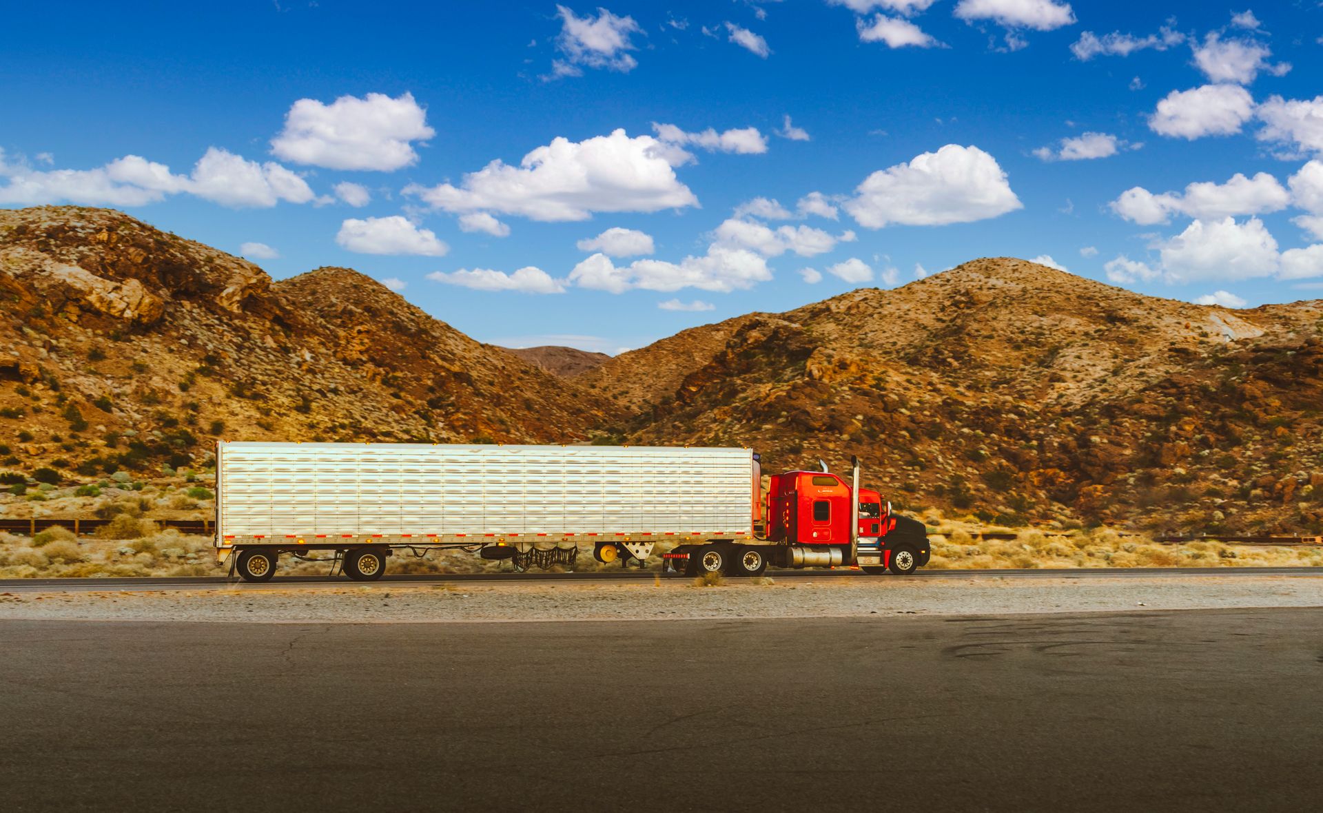 Semi truck hauling freight on an open Texas highway